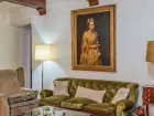 A foto no site do corretor de imóveis mostra o quadro 'Retrato de Dama', do pintor italiano Giuseppe Ghislandi (1655-1743), pendurado na parede