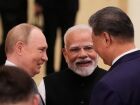 Putin, o primeiro-ministro indiano, Narendra Modi, e o presidente chinês, Xi Jinping, em Tianjin, China, na segunda-feira, 1º.