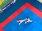 Atletas durante disputa de Kyorugui na Copa MS de Taekwondo 2025, realizada no Ginásio Moreninho, em Campo Grande.