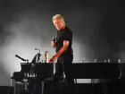 Roger Waters durante apresentação; músico afirma temer represálias por críticas ao presidente dos EUA.