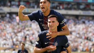 Paris Saint-Germain's Fabian Ruiz, bottom, celebrates with team mate Achraf Hakimi after scoring his side's third goal during the Club World Cup semifinal soccer match between PSG and Real Madrid in East Rutherford, N.J., Wednesday, July 9, 2025. 