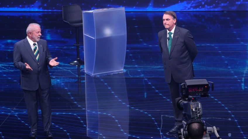 O ex-presidente Lula e o presidente Jair Bolsonaro durante debate na Band