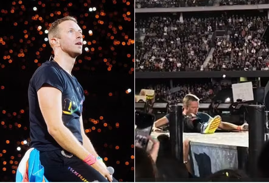 Chris Martin cai em alçapão em palco