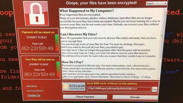 Computadores afetados por vírus de sexta-feira exibiam essa mensagem na tela, em que hackers exigiam o pagamento de resgate de US$ 300
