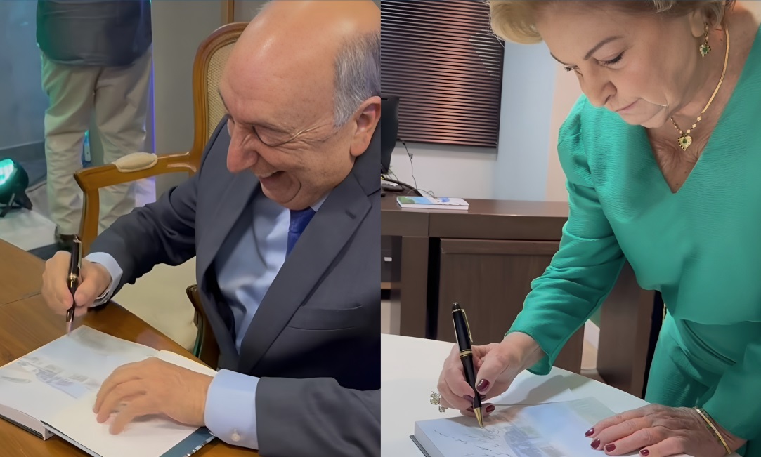 Pedro Chaves e Therezinha Samways em sessão de autógrafos, deixando dedicatórias para os leitores.