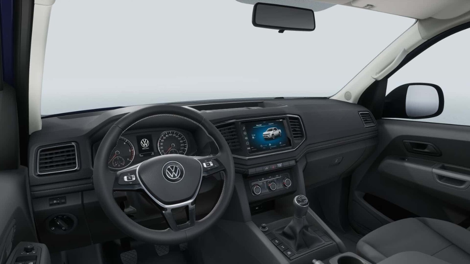 Interior da Volkswagen Amarok Trendline: volante multifuncional, central multimídia de 9 polegadas e câmbio manual de 6 marchas.