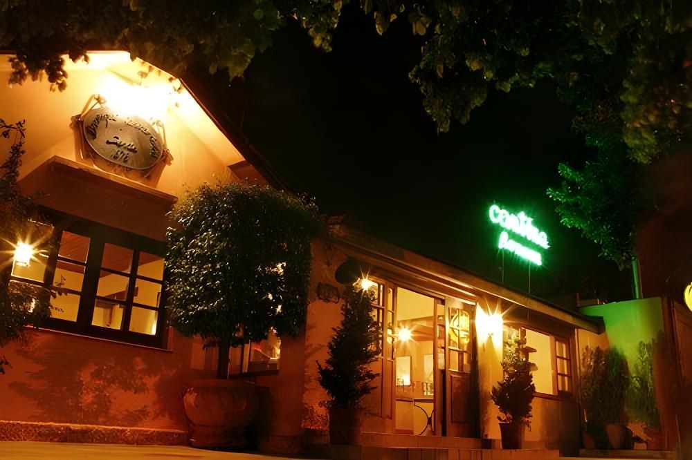 Fachada da Cantina Romana, tradicional restaurante italiano fundado em 1978 em Campo Grande; massas artesanais seguem receitas clássicas.
