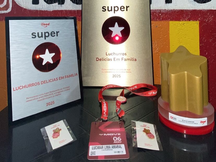 Os troféus conquistados pela LuChurros em 2025, incluindo o selo Estrela Local, o título de Melhor Sobremesa do Centro-Oeste e credenciais do evento.